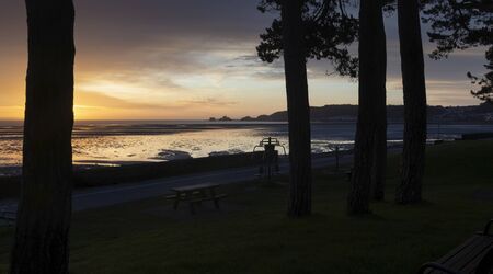 A Winter sunrise at the promenade at West Cross and Swansea Bay and Mumbles UKの写真素材