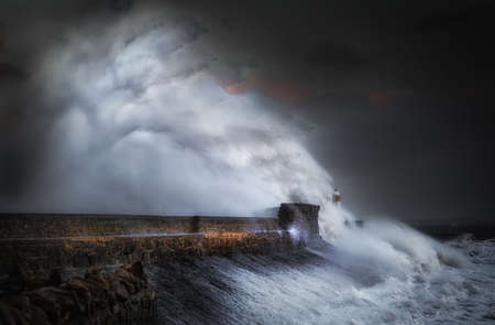 Porthcawl lighthouse in the jaws of Storm Ophelia as the hurricane hits the coast of South Wales, UKの写真素材