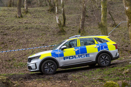 A slightly muddy British police car at a crime scene in Wales, UKのeditorial素材