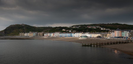 Editorial Aberystwyth; UK - June 27; 2021: A row of colourful Victorian guest houses on North Beach in the university town of Aberystwyth, Wales UKのeditorial素材