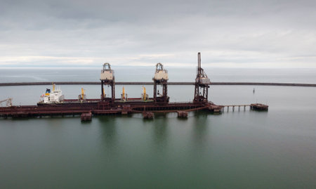 Editorial Aberavon, UK - July 9, 2021: A ship unloading its cargo at the TATA steel works in Port Talbot, UK.のeditorial素材