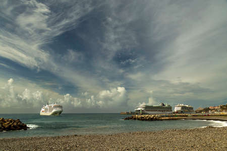 Editorial Madeira, Portugal - March 28, 2022: Cruise ships in the island of Funchal, Madeira, Portugal.のeditorial素材
