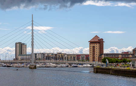 Editorial Swansea, UK - May 24, 2022: The Sail bridge over the River Tawe and Swansea Marina.のeditorial素材