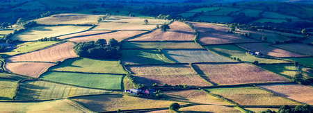The patchwork agricultural fields of Brecon as seen from the site of an Iron Age hill fort at Mynydd...