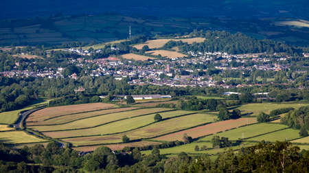 A view from the Iron Age hill fort of Mynydd Illtud of the historic Welsh town of Brecon in South Wales UKの写真素材