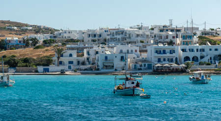 Fishing boats and coastline on Koufonissi island in the Aegean Sea, Greece.