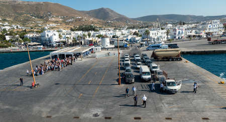 Travellers and cars waiting for the ferry at the port of Naxos Island in the Aegean Sea, Greece.のeditorial素材