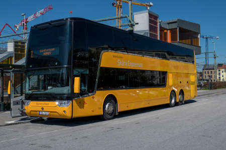 Regional bus at a stop outside the central station in Lund, Skane, Sweden.のeditorial素材