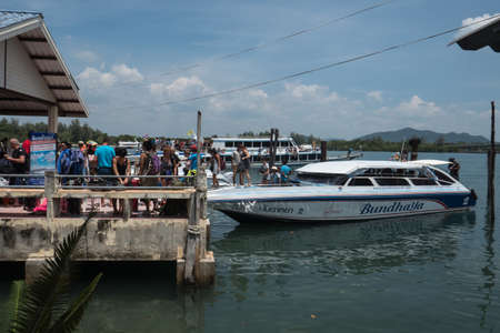 Passengers and ships the port of Saladan on the northern part of Koh Lanta island in southern Thailand.のeditorial素材