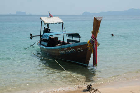 Longtail boat by the beach on the small island Koh Kradan in southern Thailand.のeditorial素材