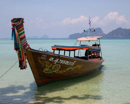 Longtail boat by the beach on Koh Kradan island in southern Thailand.のeditorial素材