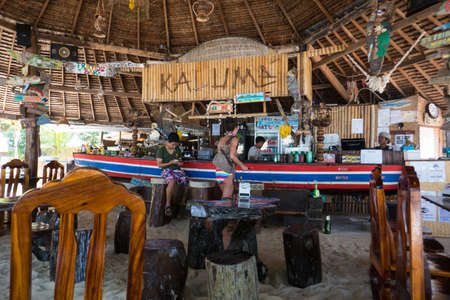 People in a bar on the small island of Koh Kradan in southern Thailand.のeditorial素材