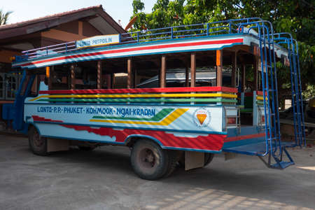 Colorful bus on a street on Koh Lanta island in southern Thailand.のeditorial素材