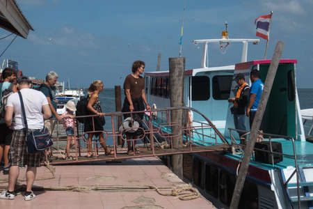 The port of Saladan on the northern part of Koh Lanta island in southern Thailand. Passengers entering a ship.のeditorial素材