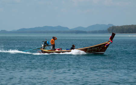 Longtail boat outside the port of Saladan, on the northern part of Koh Lanta island in southern Thailand.のeditorial素材