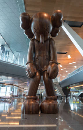 Interior from the main terminal at Hamad International Airport in Doha, Qatar. Huge Pinoccio sculpture as decoration.のeditorial素材