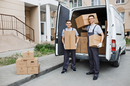 Two young handsome smiling workers wearing uniforms are standingの写真素材