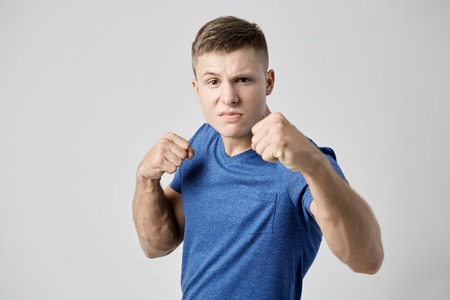 Aggressive  guy dressed in blue t-shirt