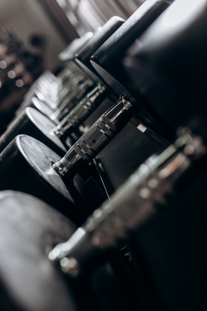 Dumbbells lie neatly on the shelfの写真素材