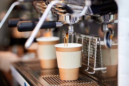 Modern coffee machine making two cups of coffee