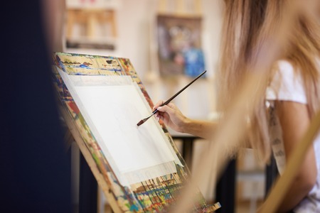 Process of painting picture at the easels in the art studioの写真素材