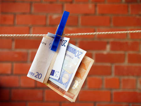 Banknotes on clotheslineの写真素材