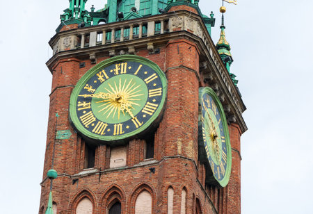 Clock tower of old historic brick town hall in Gdanskの写真素材