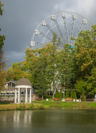 Ferris Wheel Youth Recreation Park. Ferris wheel and view of the park at the Youth Recreation Park in Kaliningrad, Russia.の写真素材