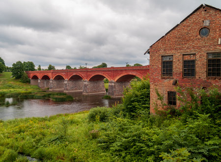 Brick bridge over Venta river in Kuldiga, Latvia.の写真素材