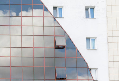 Glass and steel - mirrored facade of modern building.