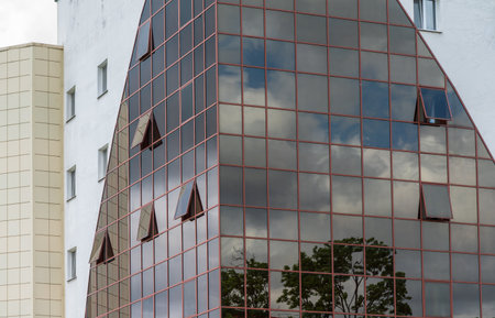 Glass and steel - mirrored facade of modern building.の写真素材