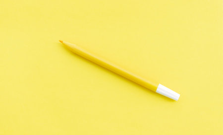 Yellow marker isolated on yellow background, after some edits.の写真素材