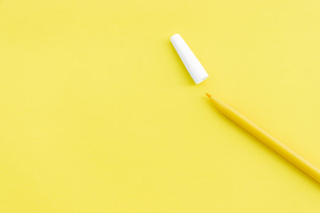 Yellow marker isolated on yellow background, after some edits.の写真素材