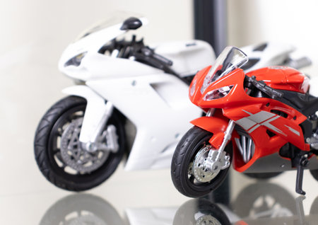 Selective focus. Model of motorbikes placed on glass shelf. After some edits.
