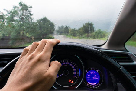 Travel concept. Car on the road on a rainy day with nature background. After some edits.
