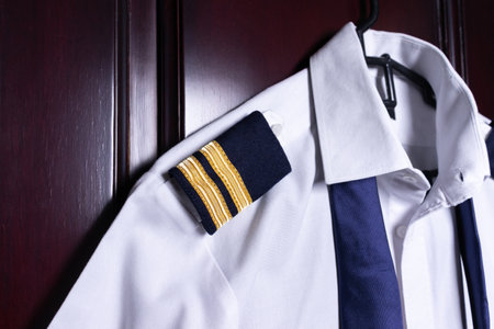 White shirt with tie on the wooden door, closeupの写真素材