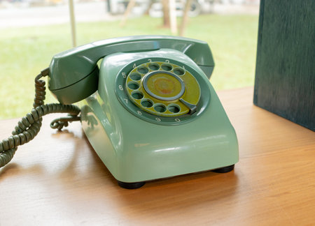 Retro green telephone with garden background. After edits.の写真素材