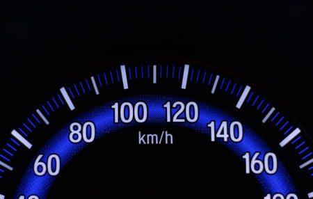 Car speedometer on black background. closeup of car instrument panel. After edits.