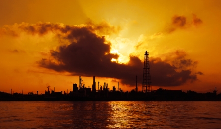 Silhouette of oil refinery at sunrise in Bangkok, Thailandの写真素材