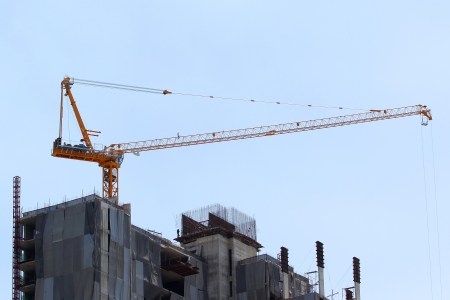 Construction site with crane on sky backgroundの写真素材
