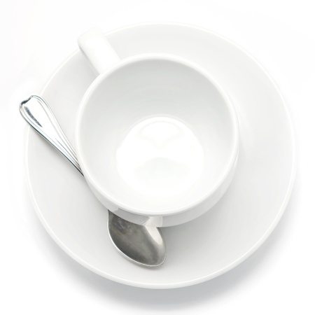 Empty coffee cup and spoon Isolated on white backgroundの写真素材