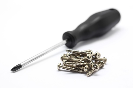 Screwdriver and screw isolated on white backgroundの写真素材