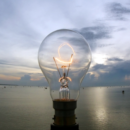 the lightbulb on beautiful sky backgroundの写真素材