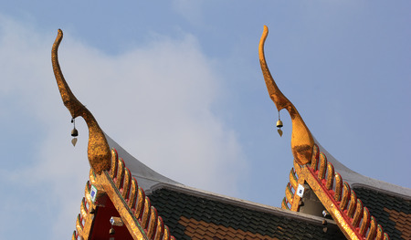 gable apex on temple roof with blue sky の写真素材
