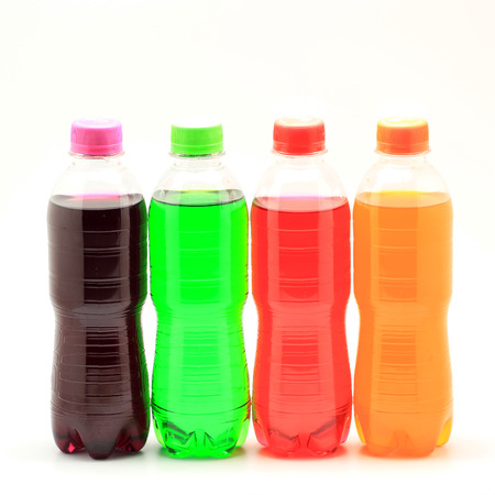 colorful of soft drink bottles isolated on a white backgroundの写真素材