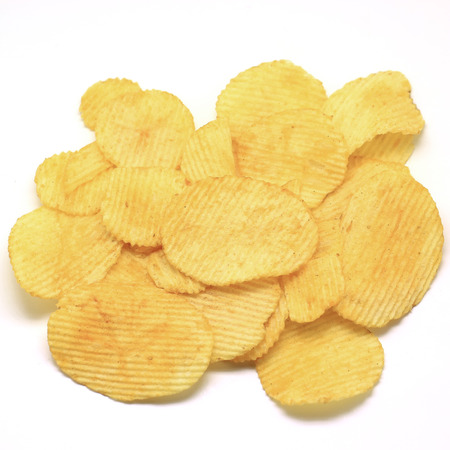 heap of potato crisps isolated on white の写真素材