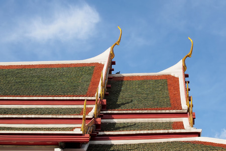 gable apex on temple roof with blue sky background