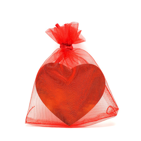 golden heart in red pouch for valentine giftの写真素材