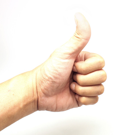 male hand showing thumbs up sign isolated on white backgroundの写真素材
