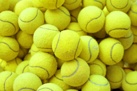 exotic yellow tennis ball as sport backgroundの写真素材